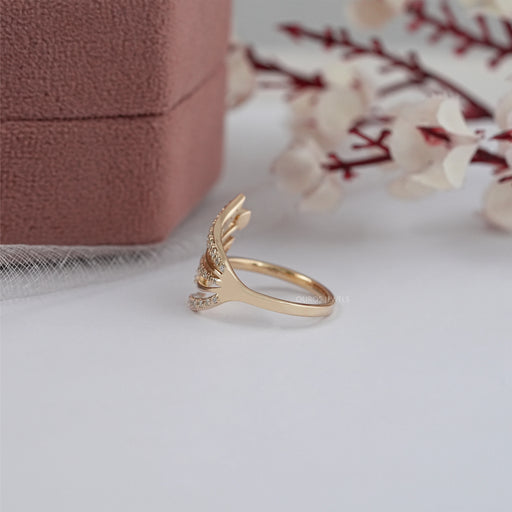 side view of round-cut lab-grown diamond angel wing ring gold
