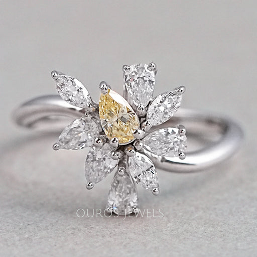 front view of yellow pear and marquise-cut cluster diamond colored engagement ring