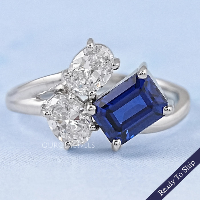 Sapphire Emerald And Oval Diamond Split Shank Engagement Ring