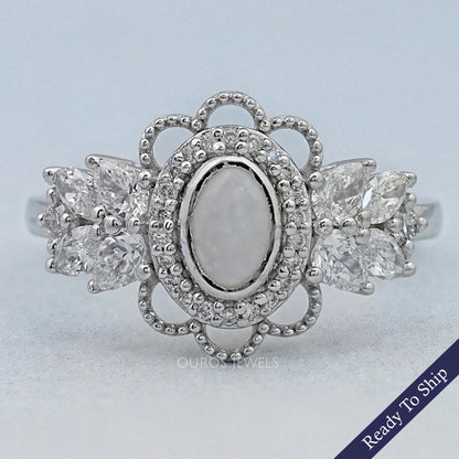 Opal Oval Cut And Halo Diamond Floral Engagement Ring