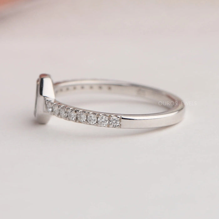 Round accent stone studded on 925 sterling silver shank of octagon diamond engagement ring