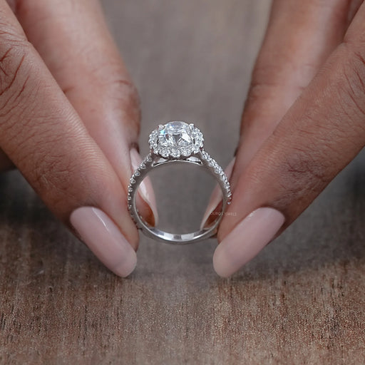 close view of old mine cushion cut diamond halo accent engagement ring