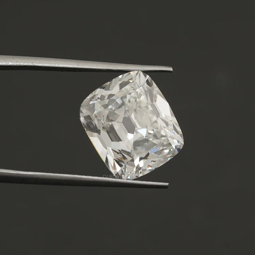 igi certified old mine cushion cut lab grown diamond by tweezer holding