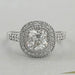 old mine cushion diamond halo engagement ring's front view on grey background