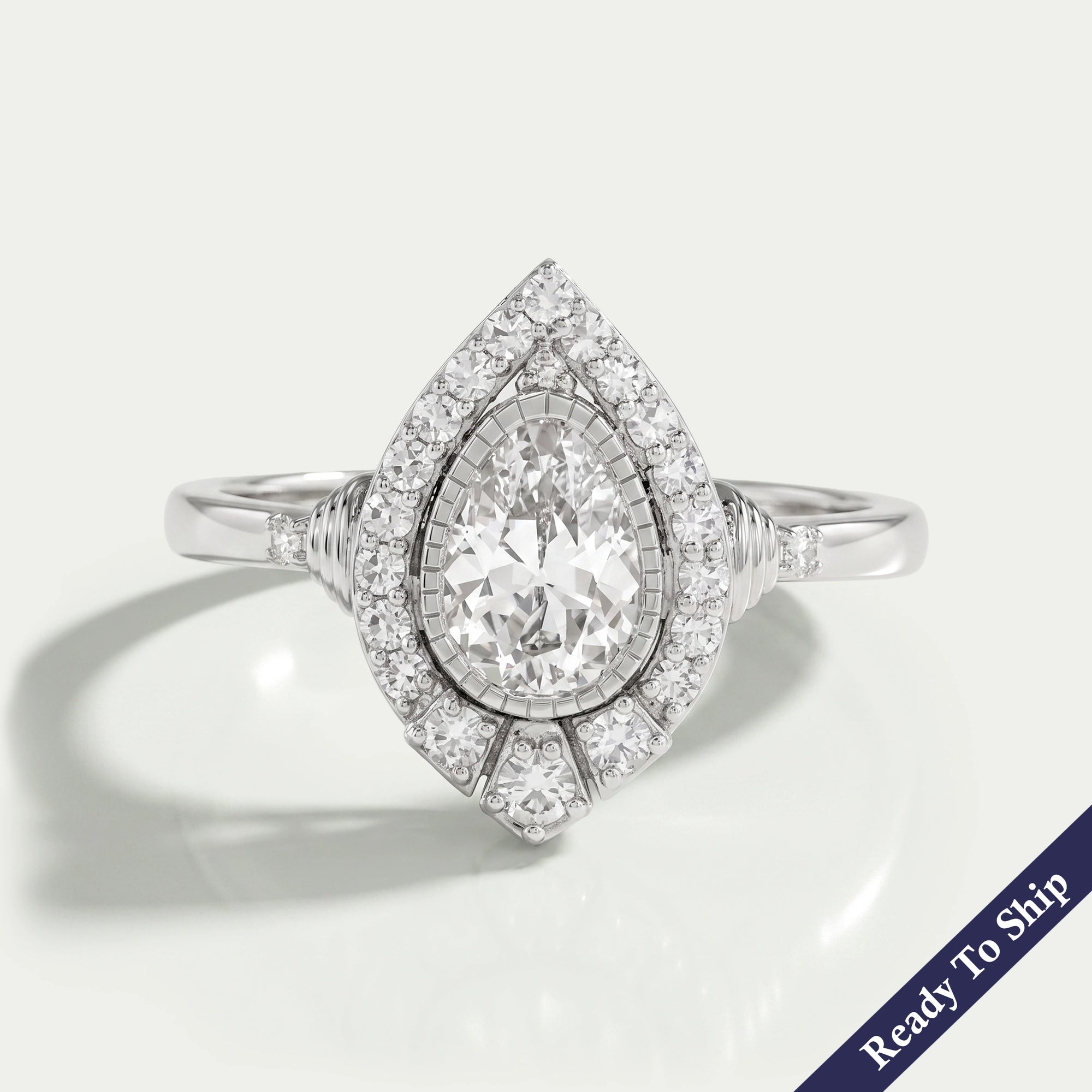 Old Mine Pear Cut And Single Round Halo Engagement Ring