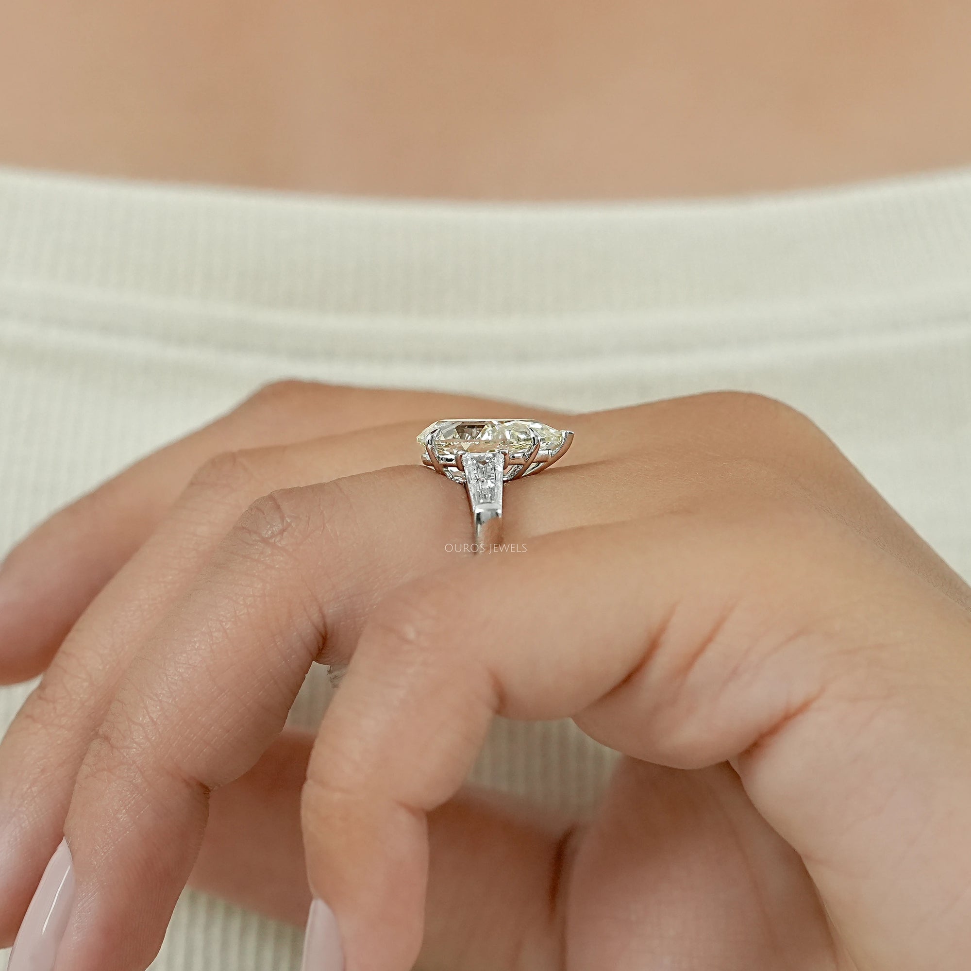 Pear Cut Three Stone Engagement Ring with Tapered Baguettes