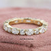 front view of oval and round lab grown diamond eternity wedding band yellow gold