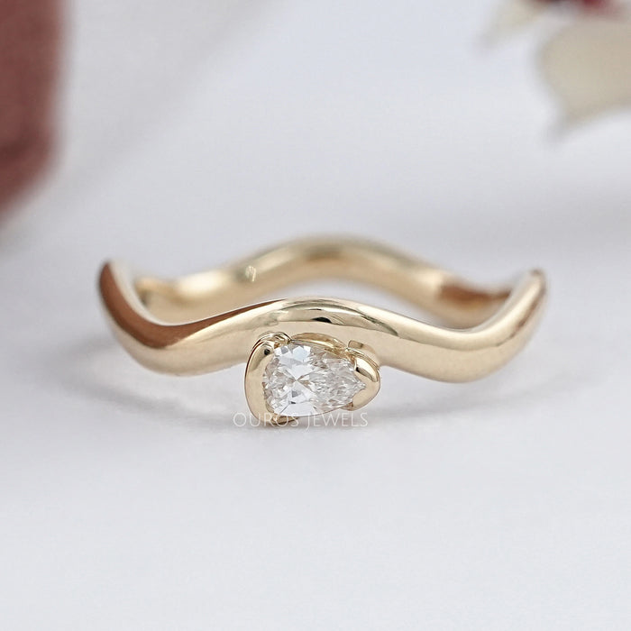 Pear Cut Diamond And Wave Gold Anniversary Ring