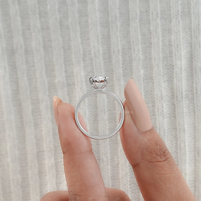 close view of pear cut lab diamond solitaire engagement ring