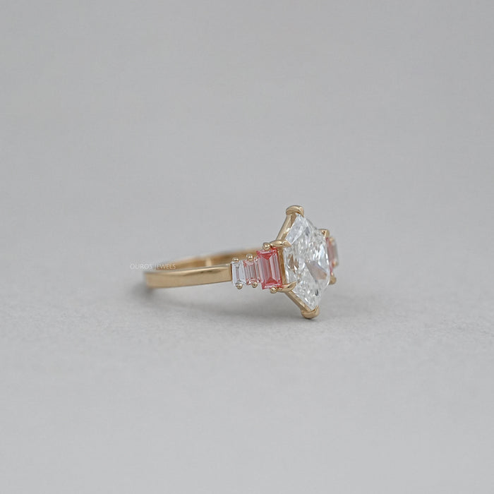 side view of dutch marquise cut with baguette diamond engagement ring on fabric