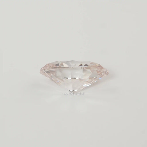 side view of certified oval cut lab grown pink diamond loose