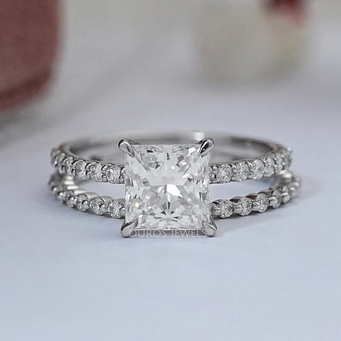 front view of princess-cut diamond solitaire bridal ring set with white gold band