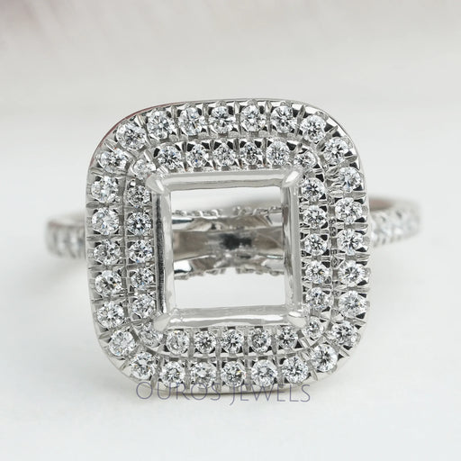 front view of princess-cut semi-mount double halo engagement ring on fabric