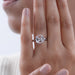 round shape hidden halo semi mount engagement ring on model's finger