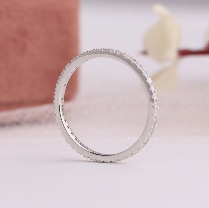 side view of round cut lab grown diamond eternity wedding ring white gold