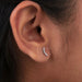 round lab grown diamond curved bar stud earrings white gold on ear