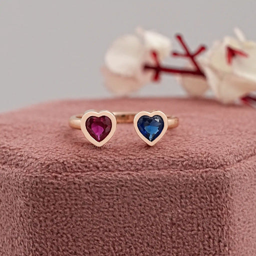 sapphire and red ruby heart shape bezel set open wedding band on jewelry box