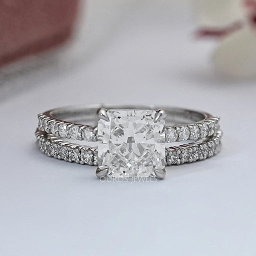 front view of square radiant-cut diamond solitaire bridal ring set on grey fabric