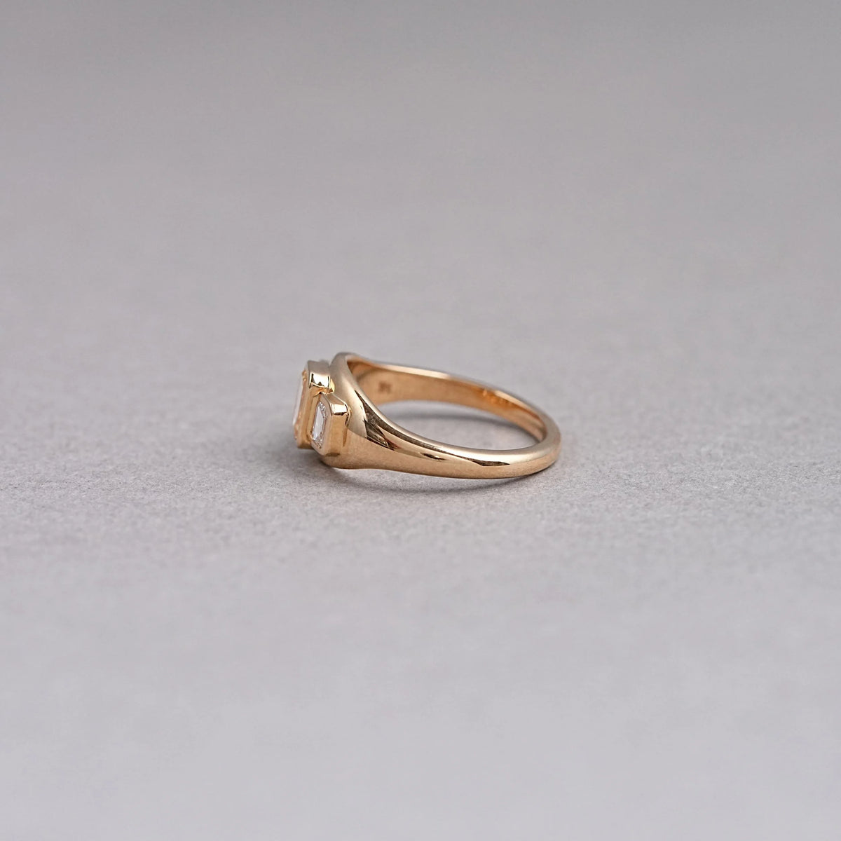 Bezel Set Yellow Emerald Cut 3 Stone Diamond Ring