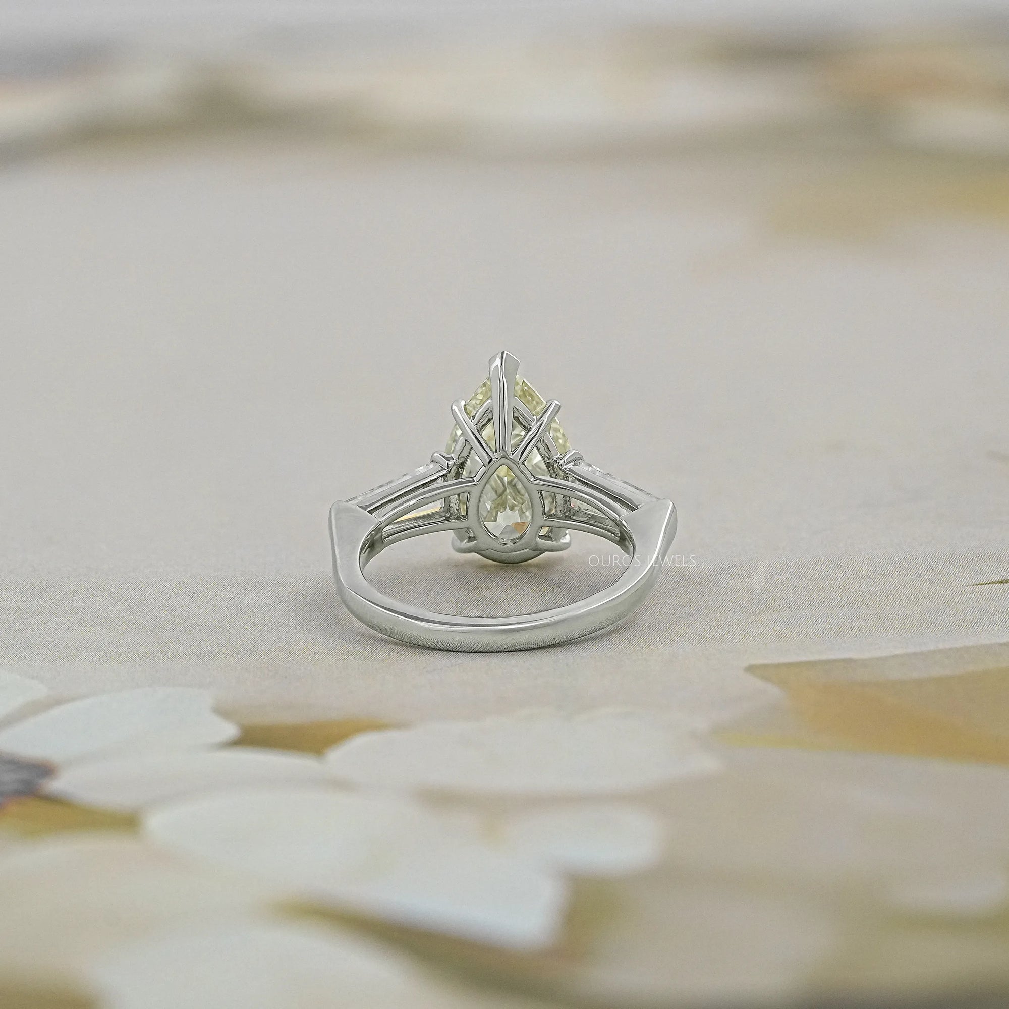 Pear Cut Three Stone Engagement Ring with Tapered Baguettes