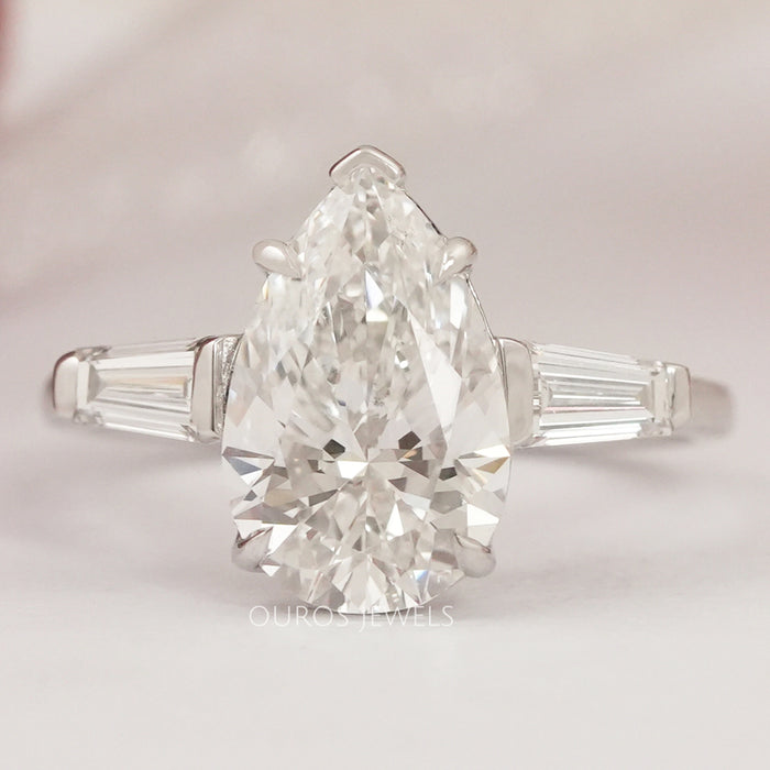 Pear Cut Three Stone Engagement Ring with Tapered Baguettes