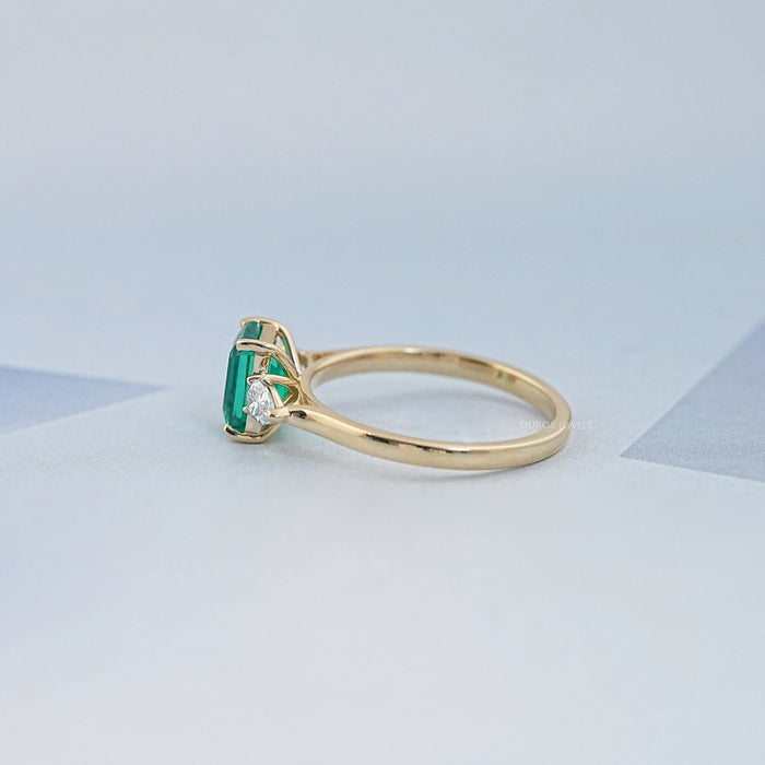 Emerald Gemstone And Pear Diamond Trio Engagement Ring
