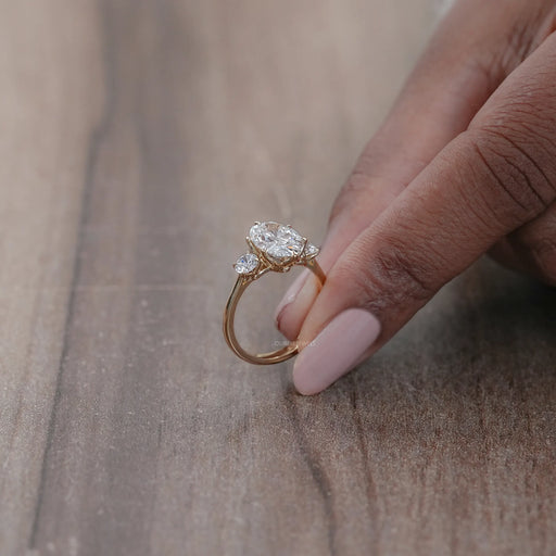side view of oval cut lab made diamond three stone engagement ring