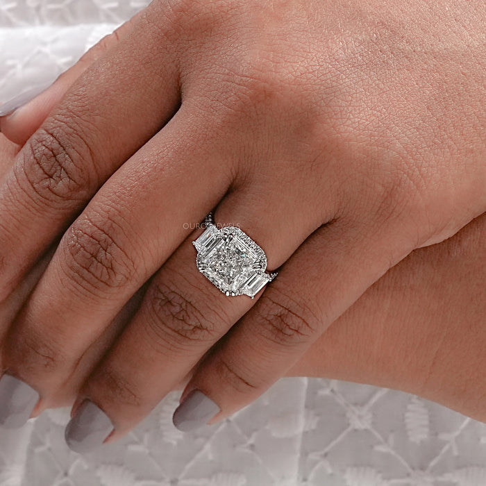 square radiant cut diamond with halo accent three stone ring on model's finger