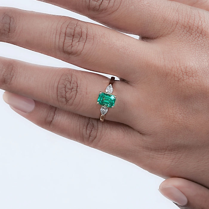 Emerald Gemstone And Pear Diamond Trio Engagement Ring