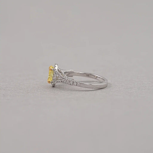 side view of yellow oval cut diamond split shank halo engagement ring