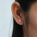 pink radiant cut lab grown diamond rose gold stud earrings on ear