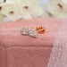 cadillac cut lab made diamond stud earrings rose gold on jewelry box