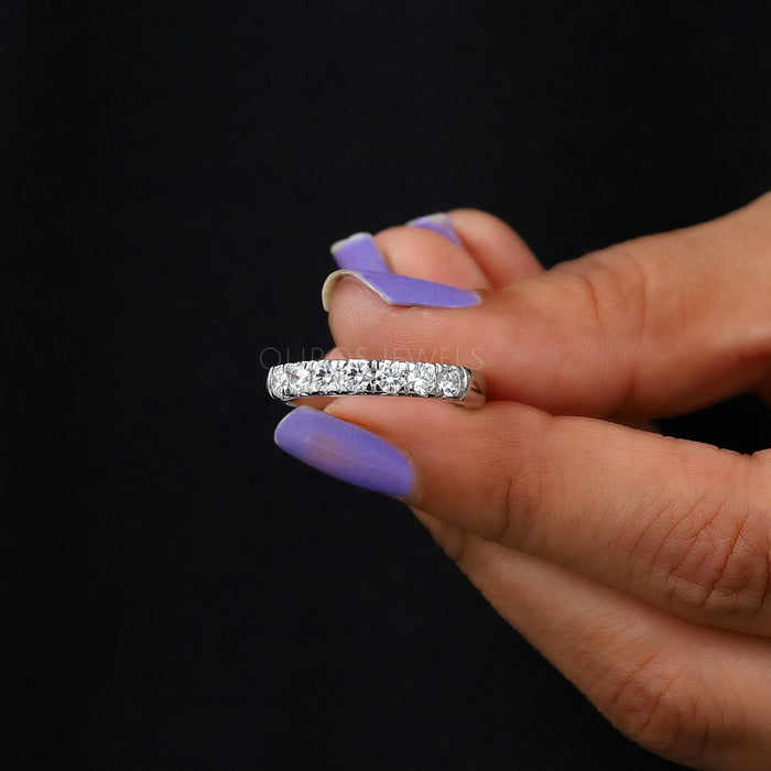 close view of round lab created diamond half white gold eternity wedding band