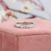 side view of round man made diamond half white gold eternity wedding band