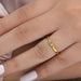 baguette cut lab diamond solitaire proposal ring in model's hand