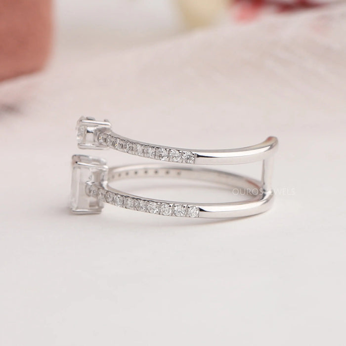 [Left Side View Of Emerald And Round Cut Lab Diamond Double Shank Ring]-[Ouros Jewels]