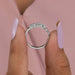 close view of emerald cut lab grown diamond five stone wedding band