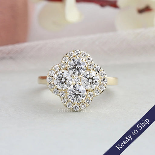 front view of round shaped diamond floral halo engagement ring yellow gold