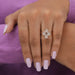 A stunning flower diamond ring with four pear shaped diamonds in a halo setting