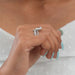 pear-cut lab-grown diamond crown-style bridal engagement ring on model's finger