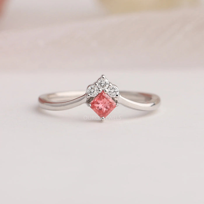 Close up view of pink princess shaped diamond ring crafted with 14k white gold & VS clarity, creates a classic look. 