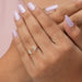 In finger front look of antique lab made diamond engagement ring in yellow gold