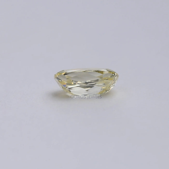 back view of vivid yellow old mine lab grown elongated cushion cut diamond
