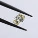 vivid yellow antique elongated cushion cut diamond loose held with tweezer