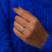 In finger front look of oval shaped diamond engagement ring in 14k white gold.