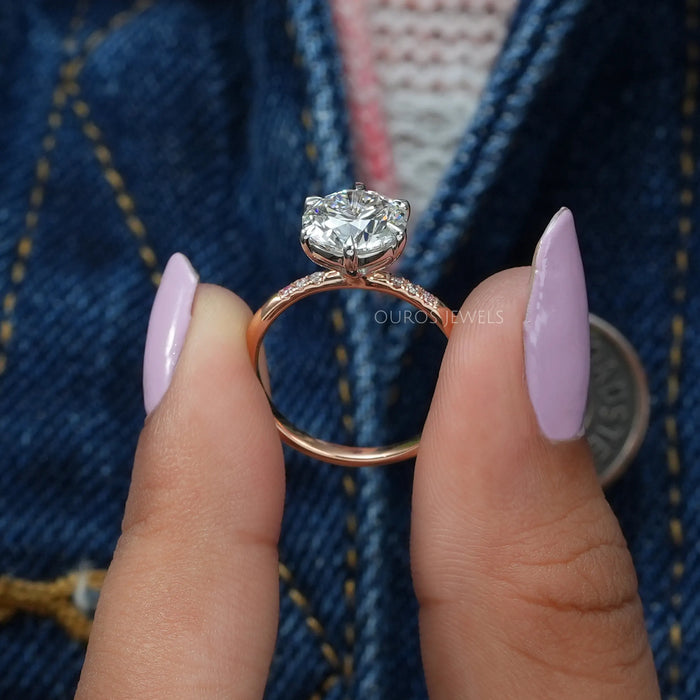close view of rose-cut round diamond solitaire accent ring with rose gold band