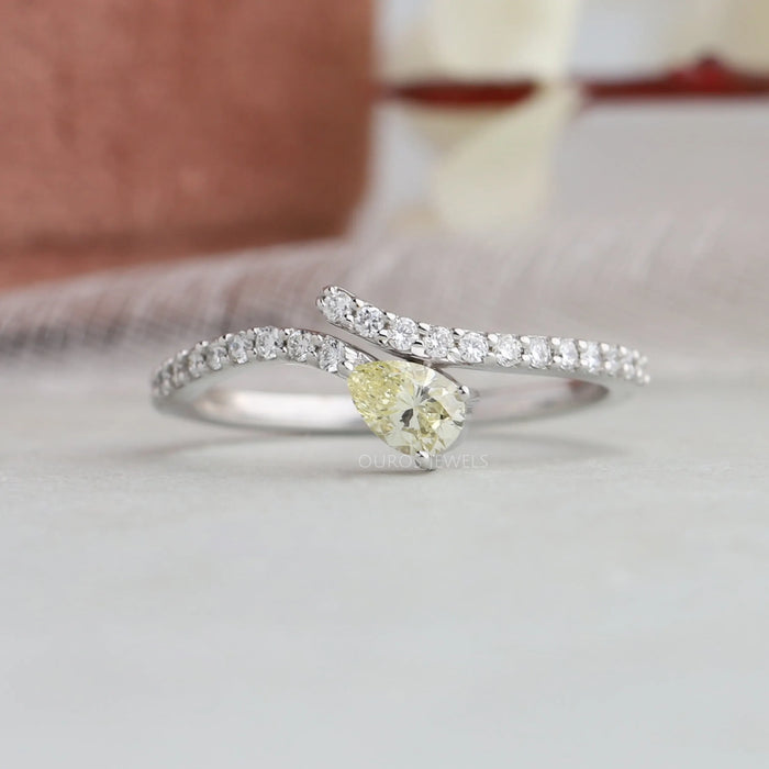 Pear shaped diamond wedding anniversary ring with yellow pear shaped eco-friendly diamond
